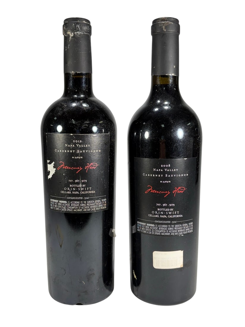 Orin Swift Mercury Head Cabernet Wine Bottles 2pcs: Lot of 2 bottles of Orin Swift Mercury Head Napa Valley Cabernet Sauvignon. Includes one 2012 vintage and one 2008 vintage, each in the distinctive Mercury Head embossed bottle. Labels identify Napa V