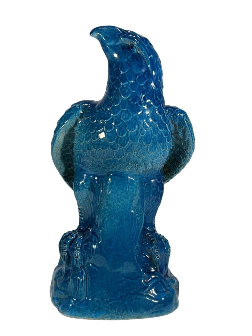 Large Blue de Chine Ceramic Eagle Figure Sculpture: Large Blue de Chine ceramic sculpture depicting an eagle perched on a rocky outcrop. Finished in a vibrant blue glaze with detailed feather, talon, and facial modeling. Decorative figural form inspire