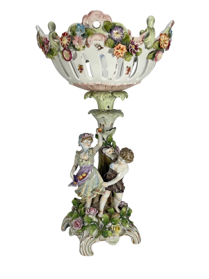 German Porcelain Floral Centerpiece Bowl Stand: Two-piece German porcelain centerpiece consisting of a pierced floral bowl and matching pedestal base. Decorated with hand-painted floral sprays and reticulated openwork rim. The upper bowl features a