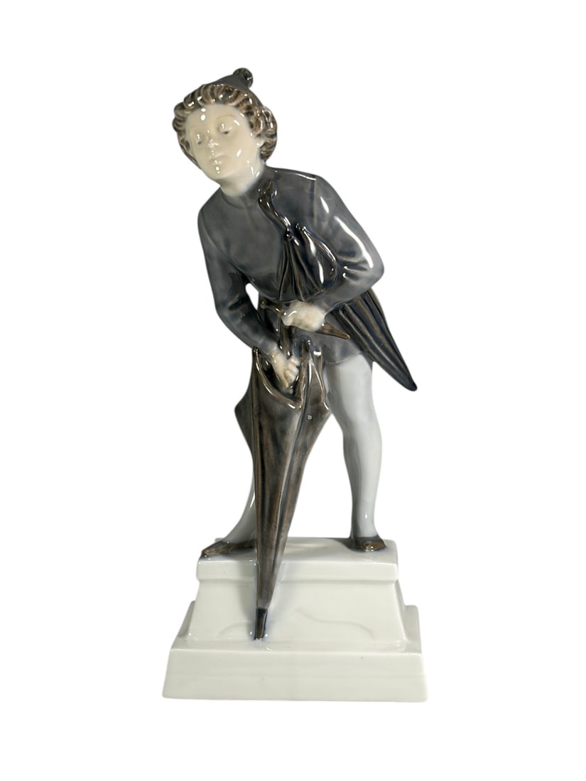 Royal Copenhagen Denmark Porcelain Figure No. 1129: White glazed Royal Copenhagen porcelain figure, marked Denmark with the factory crown mark and three blue wave trademark. Underside bears hand-painted model number 1129 and decorator's initials. Finel