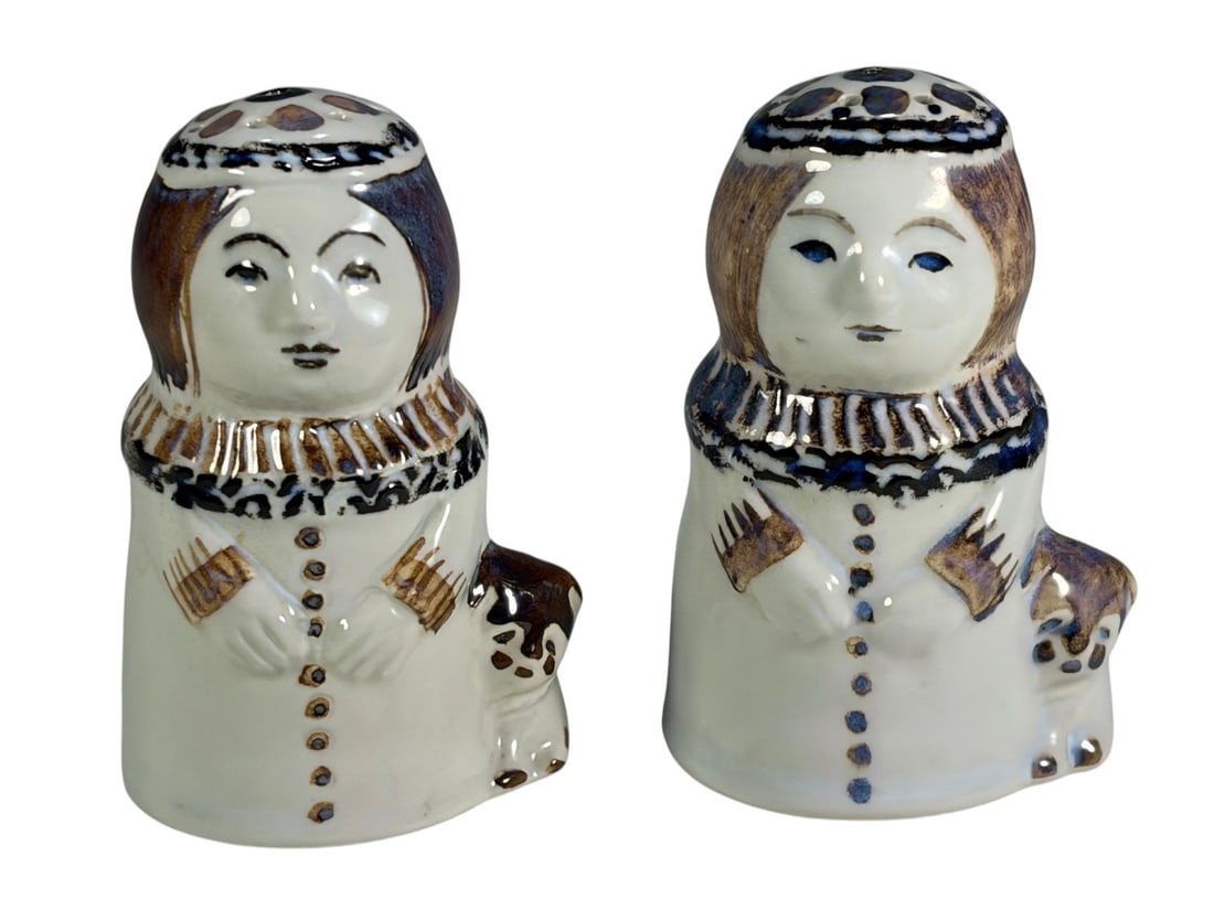 Royal Copenhagen Eskimo Salt & Pepper Shaker 2pcs: Pair of Royal Copenhagen porcelain salt and pepper shakers modeled as Inuit children in traditional attire. Hand-painted and marked with the Royal Copenhagen three-wave mark and model numbers 308 and 