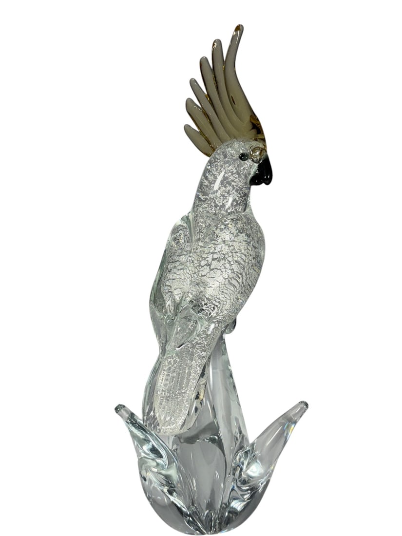 Murano Art Glass Bird Sculpture on Clear Base: Handcrafted Murano art glass bird sculpture featuring a clear body with silver aventurine-style inclusions and amber-gold crest and head details. The bird is perched on an elegant clear glass scrollin