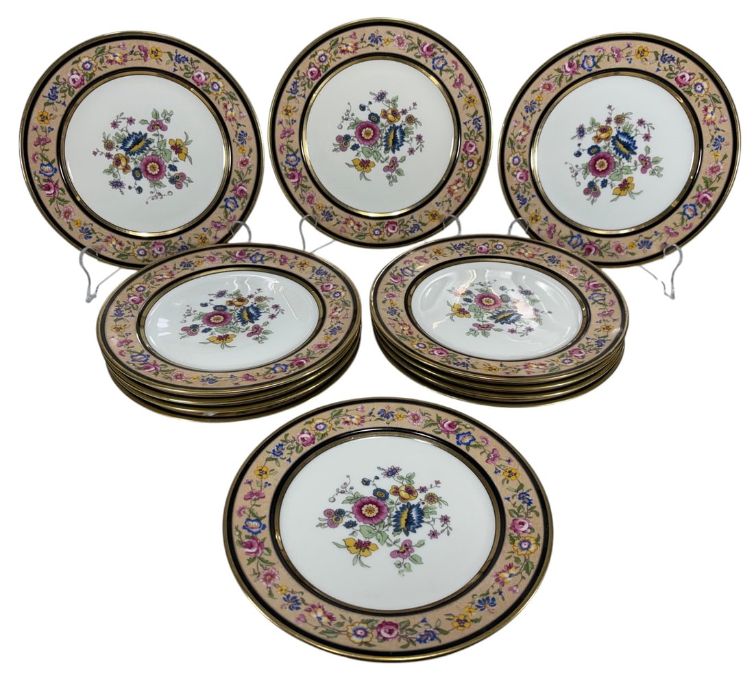 Antique French Porcelain Floral Dessert Dishes 12p: Collection of twelve antique French porcelain dishes featuring polychrome floral decoration at the center and along the border, accented with black bands and gilt trim. The undersides bear French porc