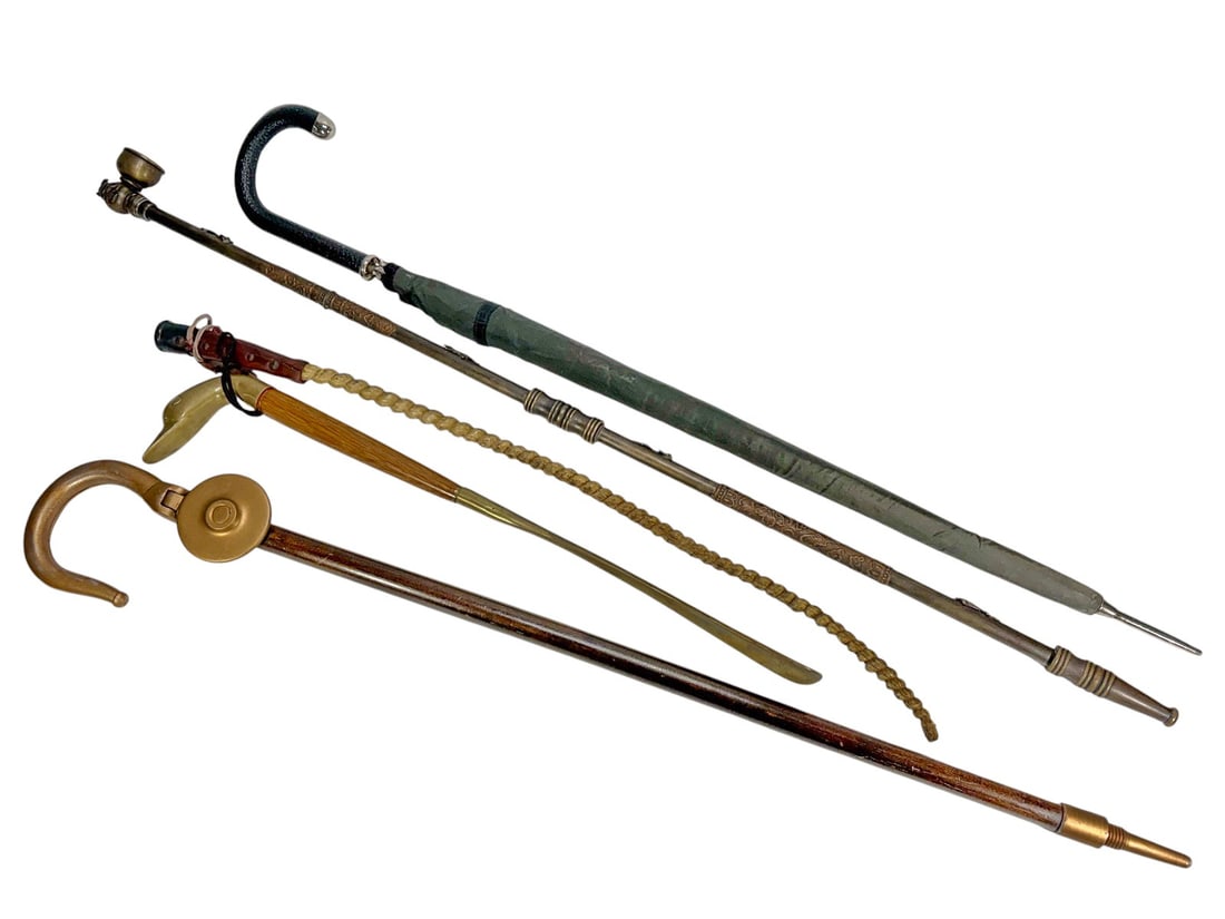 Vintage Canes, Umbrella & Walking Aids 5pc LOT: Five-piece lot of assorted walking sticks, canes, and accessories. The group includes an ornate metal walking stick or cane with decorative engraved shaft and figural handle, a wooden cane with brass-