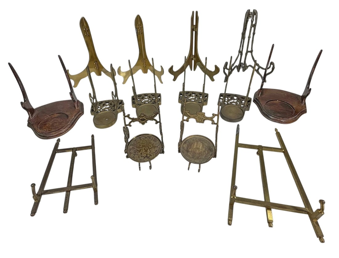 Assorted Vintage Display Stands & Easels 14pc LOT: Group of fourteen vintage display stands and easels in brass, silver-tone metal, painted metal, and wood. Includes folding easels, plate stands, decorative tabletop display holders, and carved wooden 