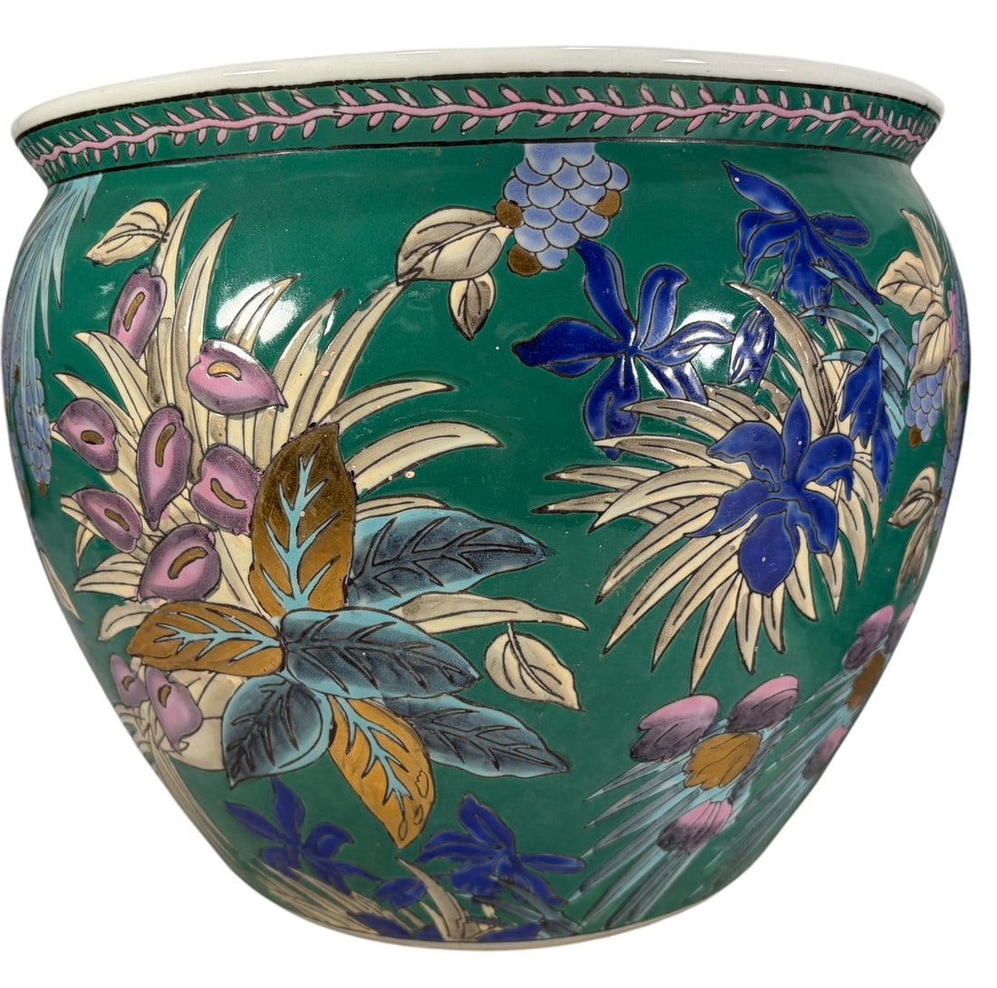 Decorative Green Floral Ceramic Cachepots 2pc LOT: Pair of decorative ceramic cachepots or planter pots with colorful raised floral and botanical motifs. One example features a green ground with stylized flowers and foliage, while the other displays f