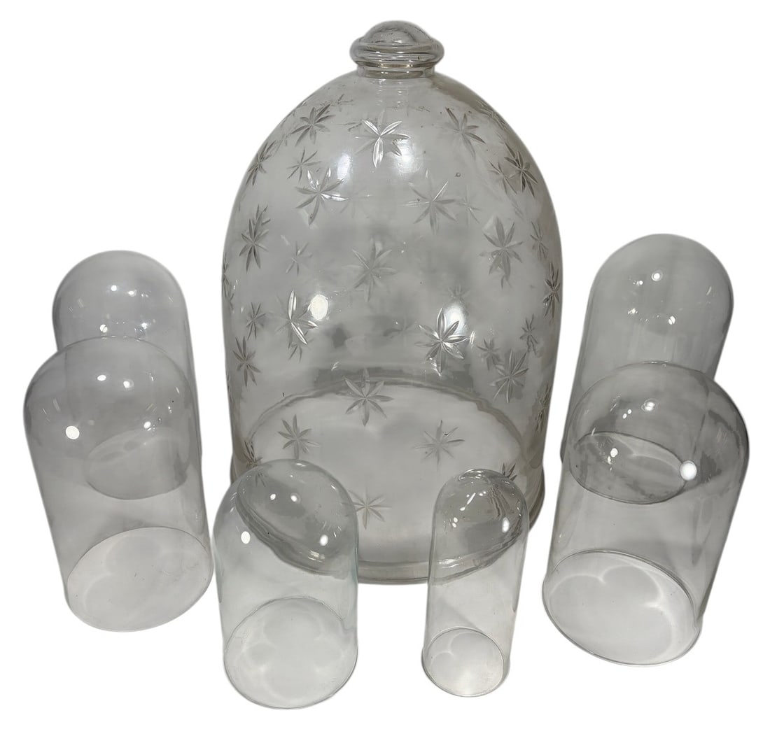 Decorative Glass Display Domes Collection 7pc LOT: Collection of seven clear glass display domes, including one large bell jar with etched starburst decoration and matching glass finial, together with six additional clear glass domes of varying sizes 