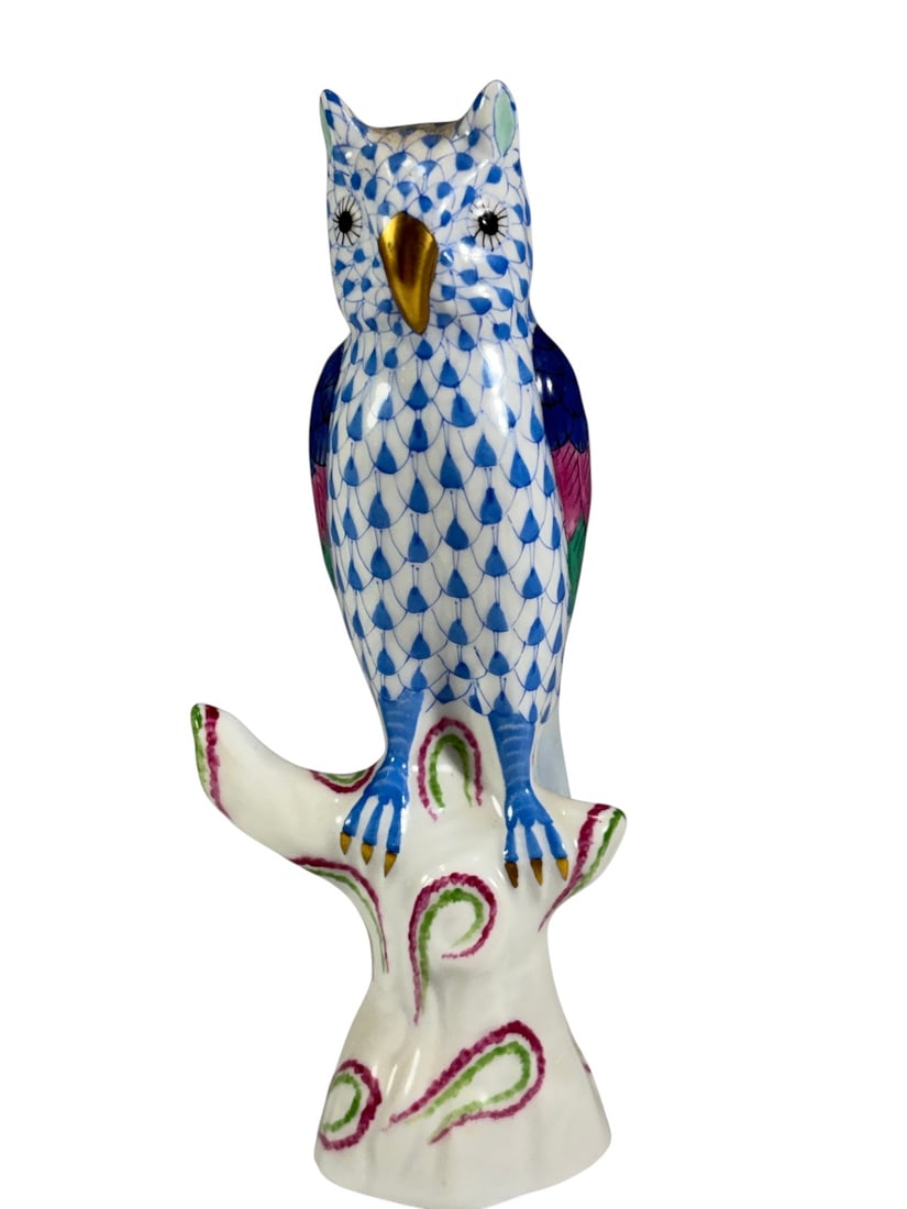 Herend Hungary Fishnet Porcelain Blue Owl Figurine: Herend Hungary hand-painted porcelain owl figurine perched on a stylized tree stump. Decorated in the iconic blue fishnet pattern with multicolor wings, gilt beak and talons, and a white base accented