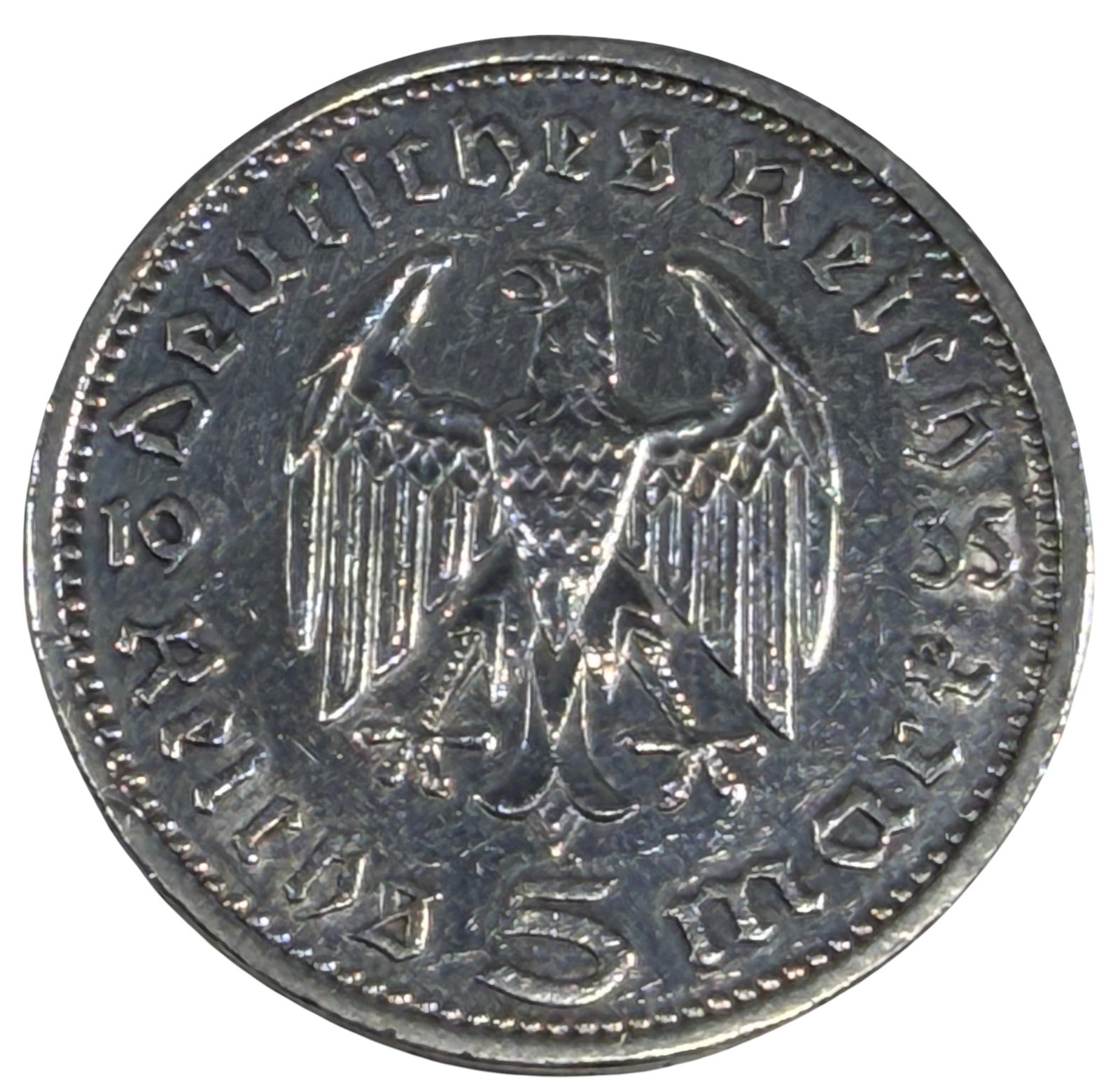 1934 Germany 5 Reichsmark Hindenburg Silver Coin: 1934 Germany 5 Reichsmark silver coin featuring the portrait of Paul von Hindenburg (1847-1934) on the obverse and the German eagle with denomination on the reverse. Dated 1934. Struck in .900 silver.