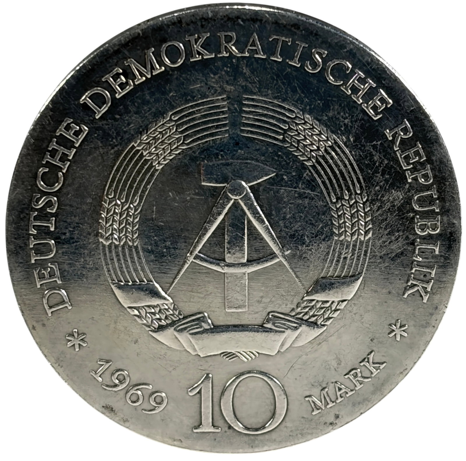 1969 GDR 10 Mark Johann Bottger Old Silver Coin: 1969 German Democratic Republic (GDR) 10 Mark commemorative coin honoring the 250th anniversary of the death of Johann Friedrich Bottger (1682-1719). Obverse features the GDR state emblem with denomin