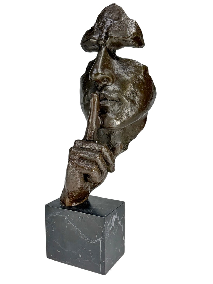 After Salvador Dali Bronze Sculpture on Marble: Modern surrealist-style bronze sculpture depicting a fragmented face with an index finger held to the lips in a "silence" gesture, mounted on a polished black marble base. No visible maker's signature