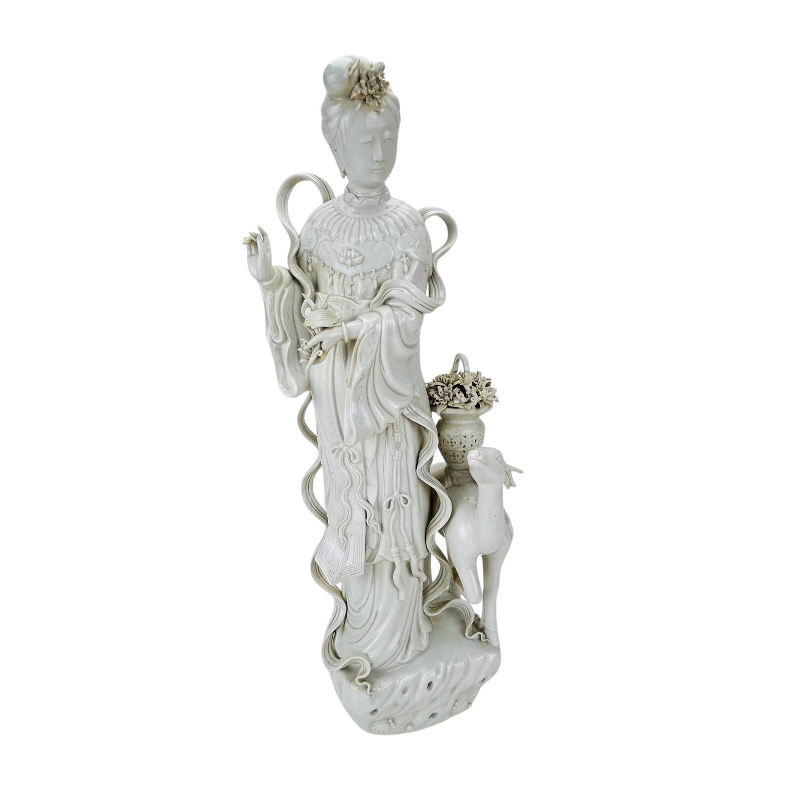 Chinese Blanc De Chine Kwan Yin w/ Deer Figurine: Blanc de Chine porcelain figural group depicting the revered Buddha deity god standing beside a deer and flower basket. Modeled with flowing robes, fan, jewelry, floral headdress, and pierced decorati