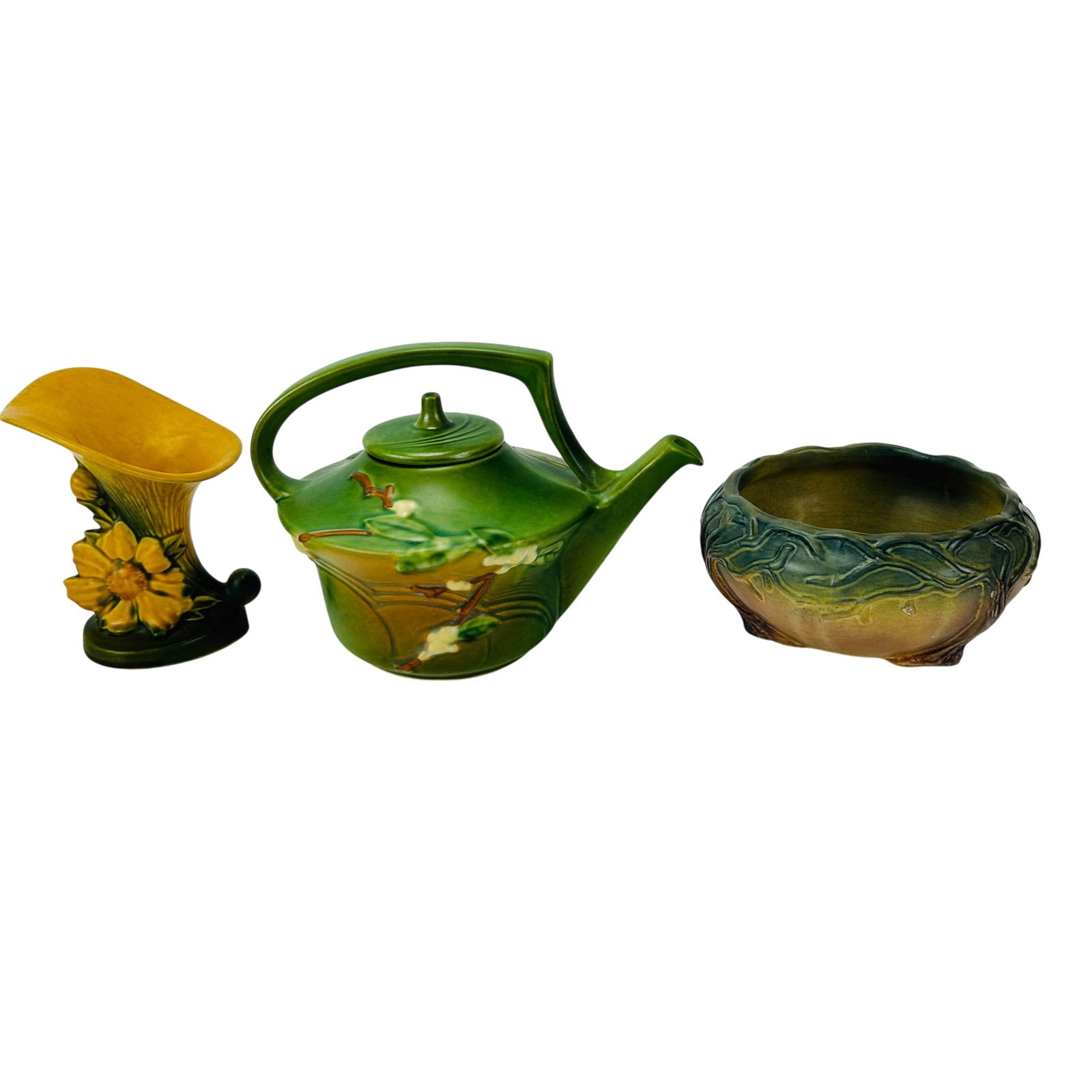 Roseville Teapot & Cornucopia & McCoy Pottery Bowl: Group of three American art pottery items. Includes a green Roseville lidded teapot in the Snowberry pattern, a cornucopia in the Peony pattern and a Nelson McCoy bowl with stylized vine decoration. M
