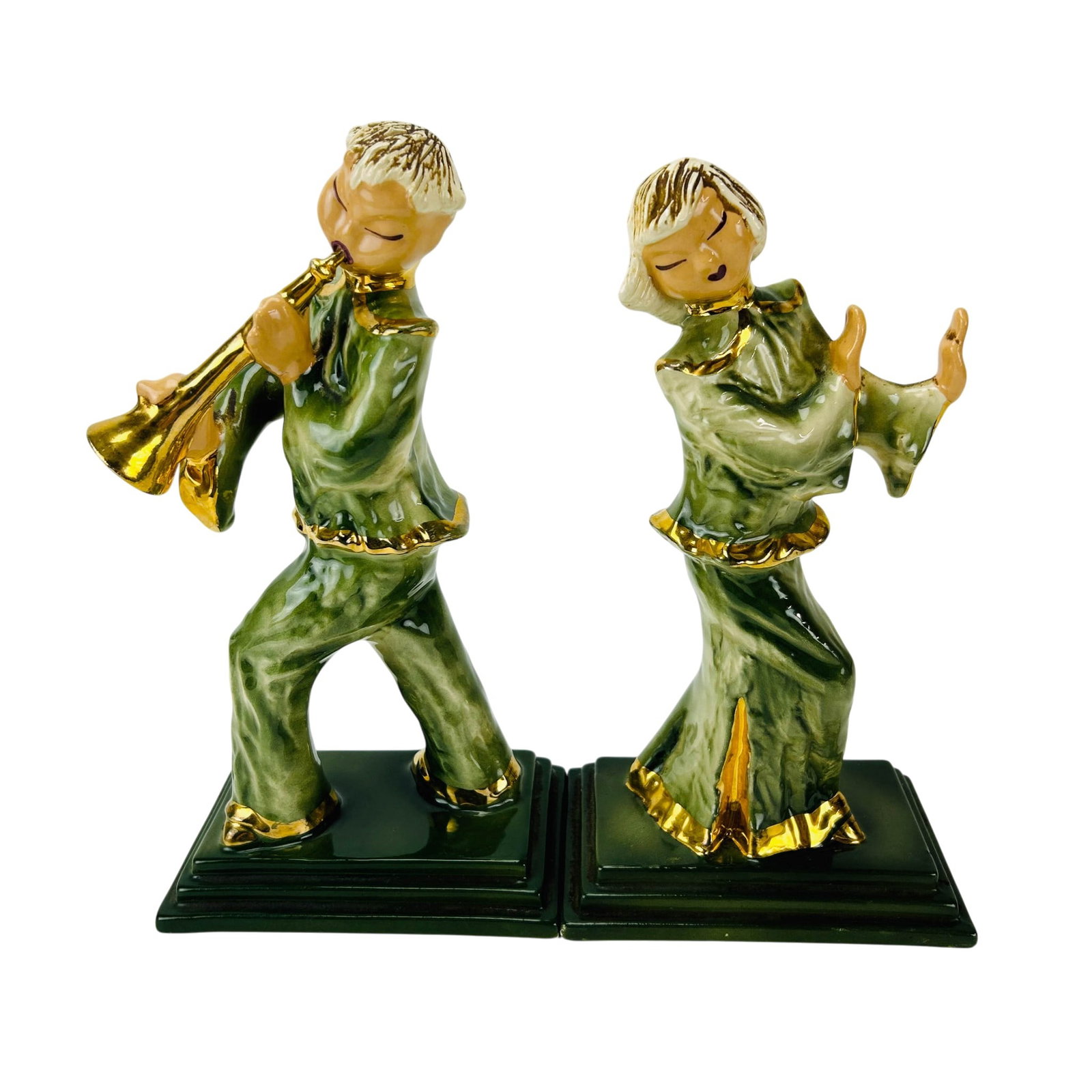 Hedi Schoop Singer & Dancer Ceramic Figurines 2pc: Pair of Hedi Schoop (born Hedwig Schoop, Swiss 1906-1995) Hollywood California ceramic figural sculptures depicting a female singer and a male trumpet player. Each figure modeled in flowing green atti