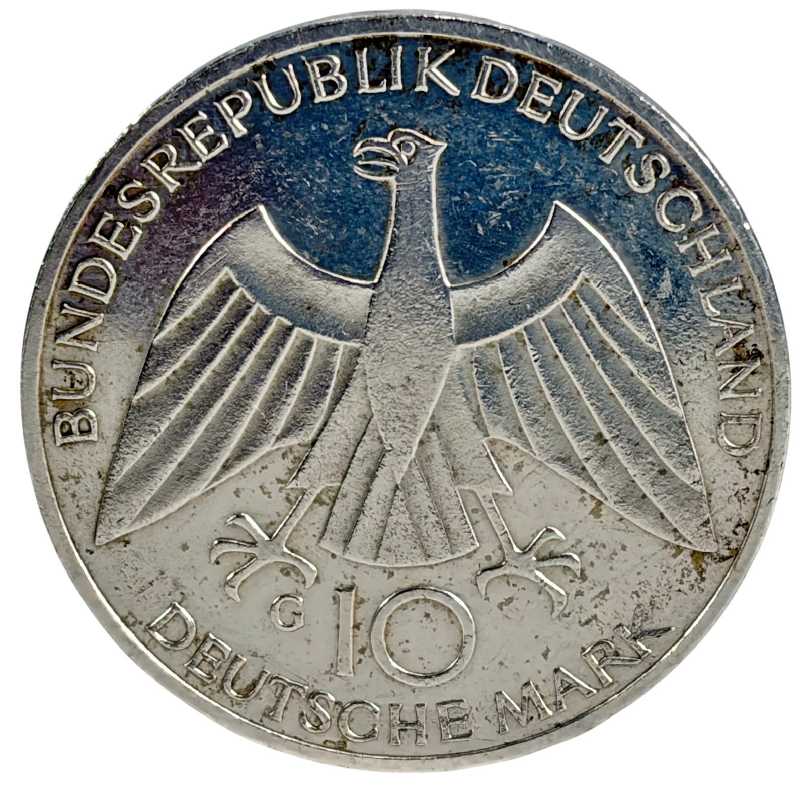 1972 Germany 10 Mark Munich Olympic Silver Coin: West Germany 10 Deutsche Mark commemorative silver coin issued for the 1972 Munich Summer Olympic Games. Obverse depicts the Federal Eagle with denomination, while the reverse features an abstract des