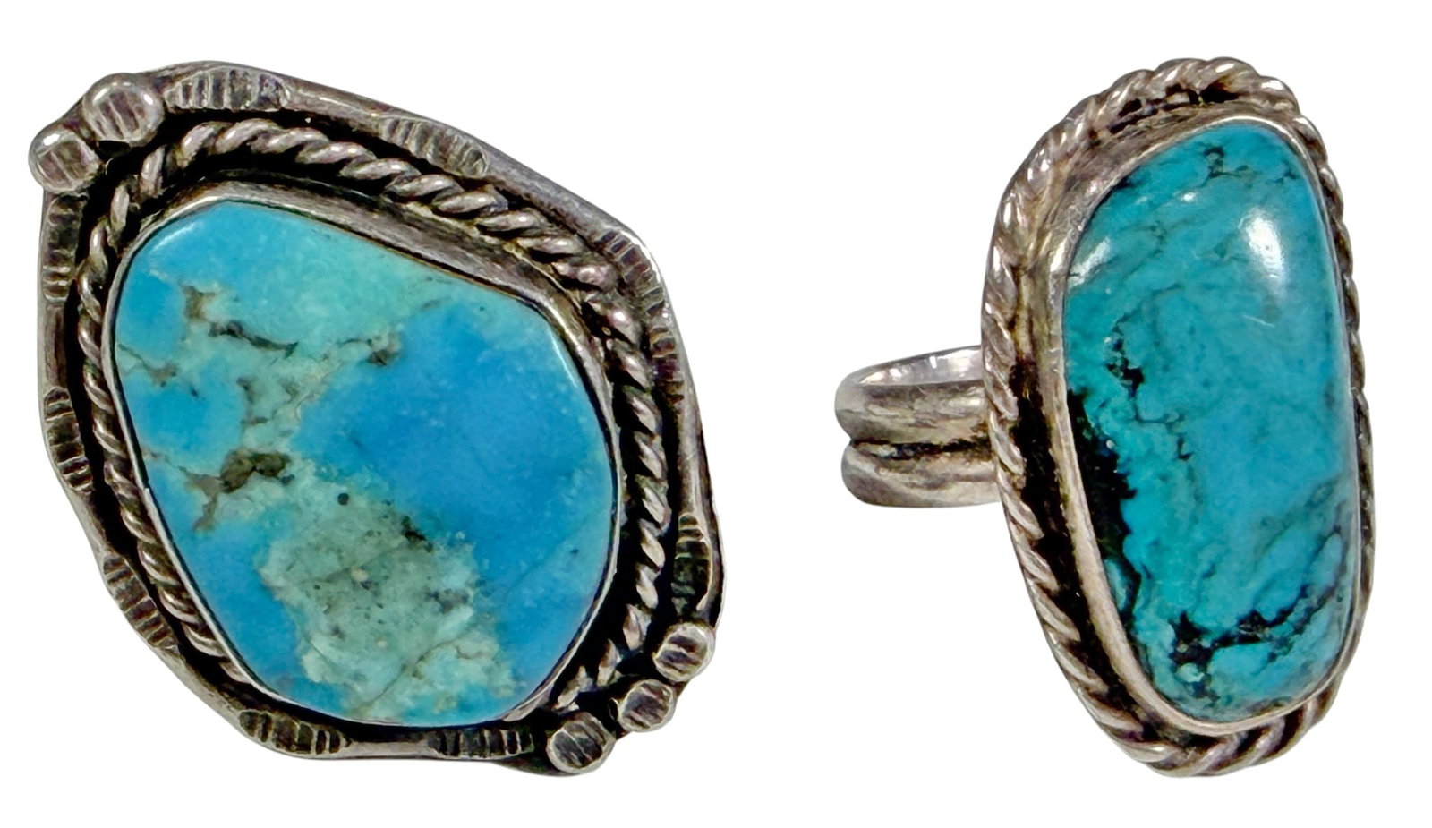 Navajo Sterling Silver Turquoise Southwestern Rings 2pcs: Two pieces lot of Navajo sterling silver rings, each set with a natural turquoise cabochon in handcrafted Southwestern-style settings with twisted wire and applied bead accents. The lot includes one l