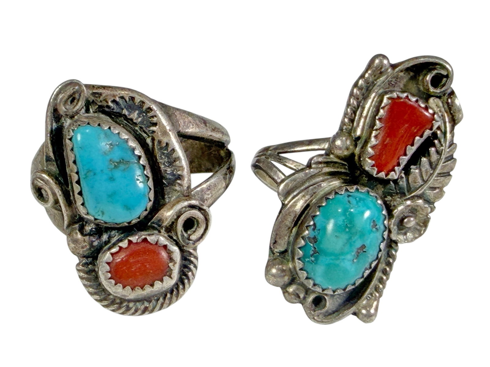 Sterling Turquoise & Coral Southwest Rings 2pc LOT: Two pc lot of sterling silver rings set with turquoise and red coral cabochons in Southwestern-style settings. The lot includes one larger ring, approximately US size 9.5, weighing 10.1 grams, and one