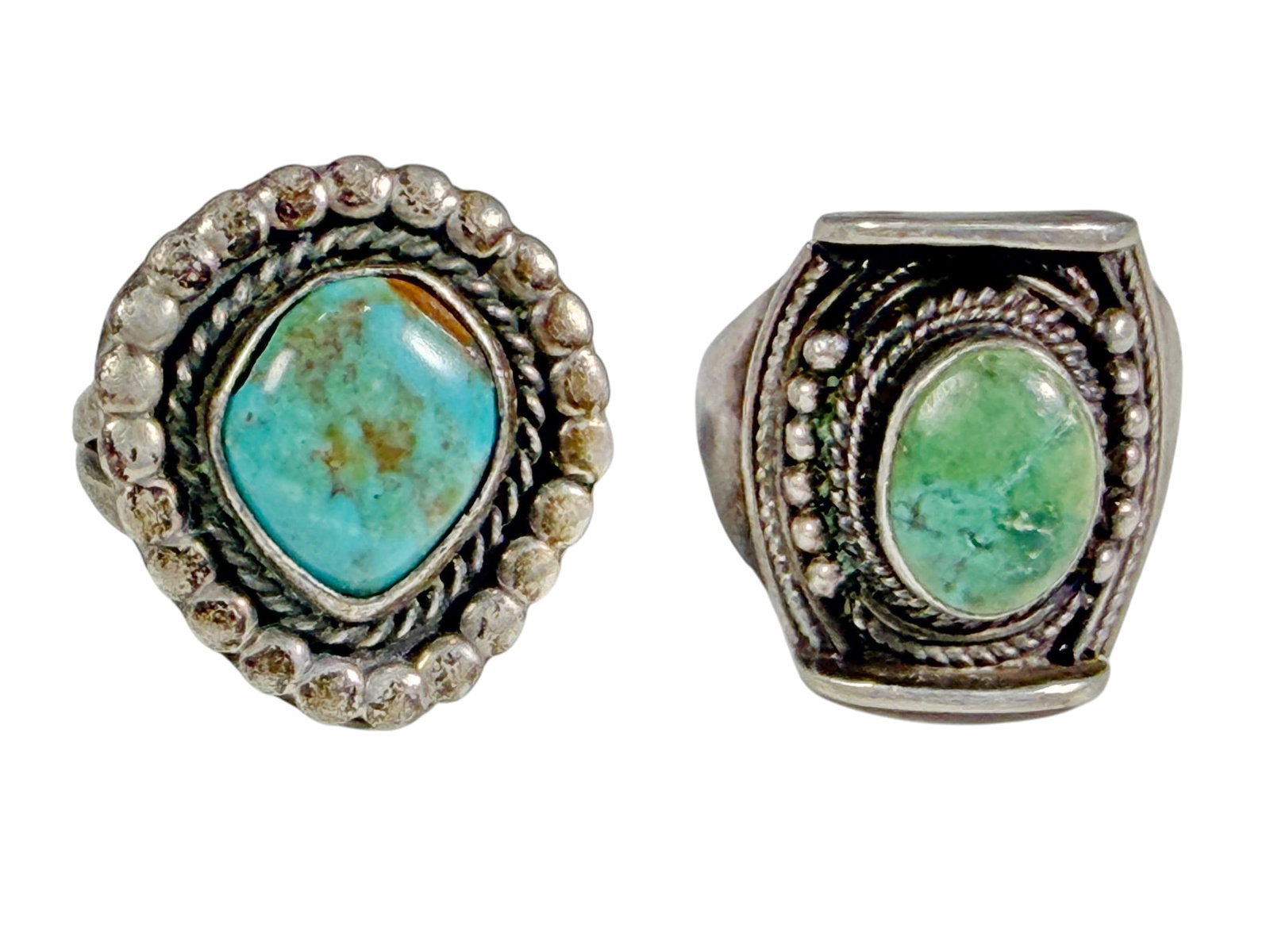 Sterling Silver Turquoise Cabochon Rings 2pc LOT: Two-piece lot of sterling silver rings, each set with an oval turquoise cabochon in handcrafted Southwestern-style settings. The signet-style ring is US size 9 with a total weight of 7.1 grams. The ro