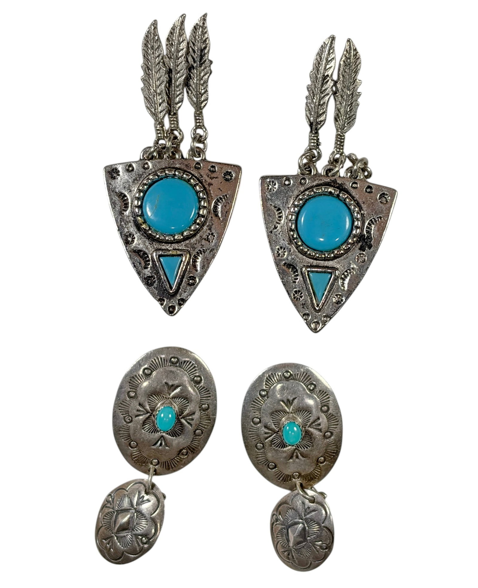 Sterling Silver Turquoise Earrings 31.9g 4pc LOT: Lot includes one pair of triangular earrings with turquoise-colored cabochons and articulated feather dangles, and one pair of engraved oval clip-on earrings accented with oval turquoise cabochons and