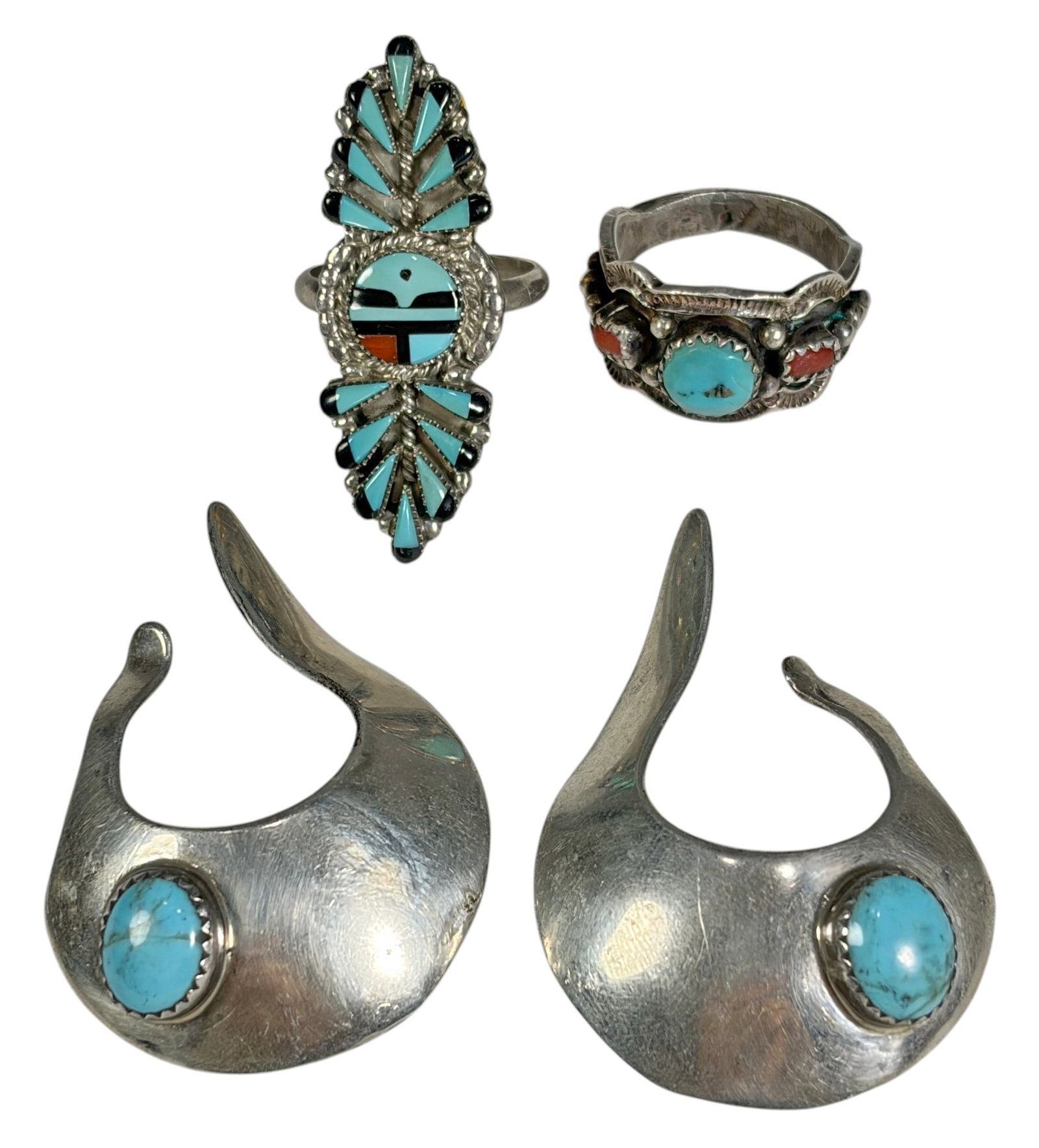 Sterling Silver Turquoise, Rings & Ear Cuffs 4pcs: Four-piece lot of sterling silver Southwestern-style jewelry. Includes one pair of turquoise cabochon ear cuffs weighing 14.0 grams total, one elongated turquoise inlay ring, size 7, weighing 5.2 gram