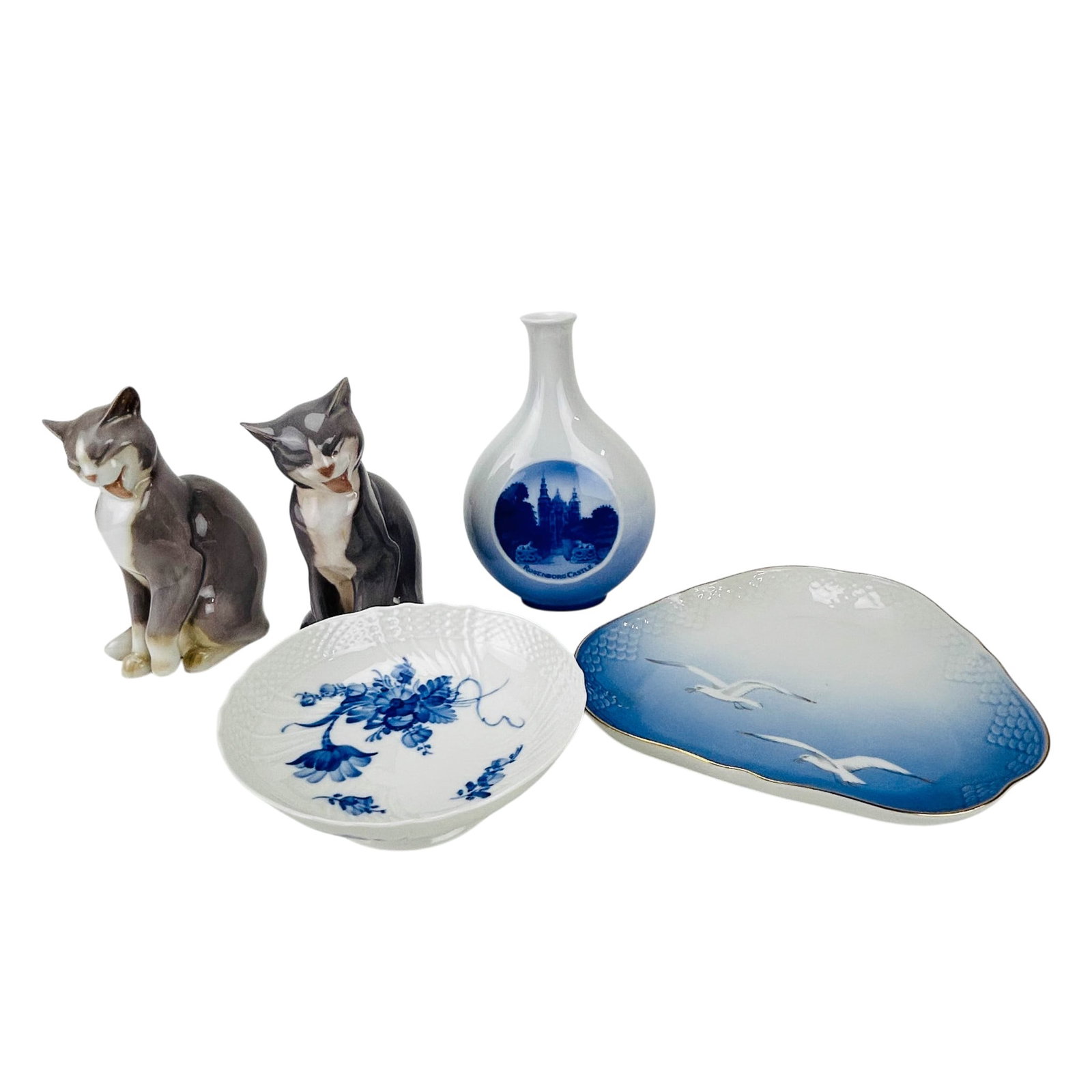 Royal Copenhagen Bing Grondahl Cat Vase Bowl 5pc: Group of Scandinavian origin porcelain items, total of five. Includes a Royal Copenhagen Blue Flowers bowl, pattern 1532 and a Rosenborg Castle souvenir vase #4373.Accompanied by a Bing & Grondahl por