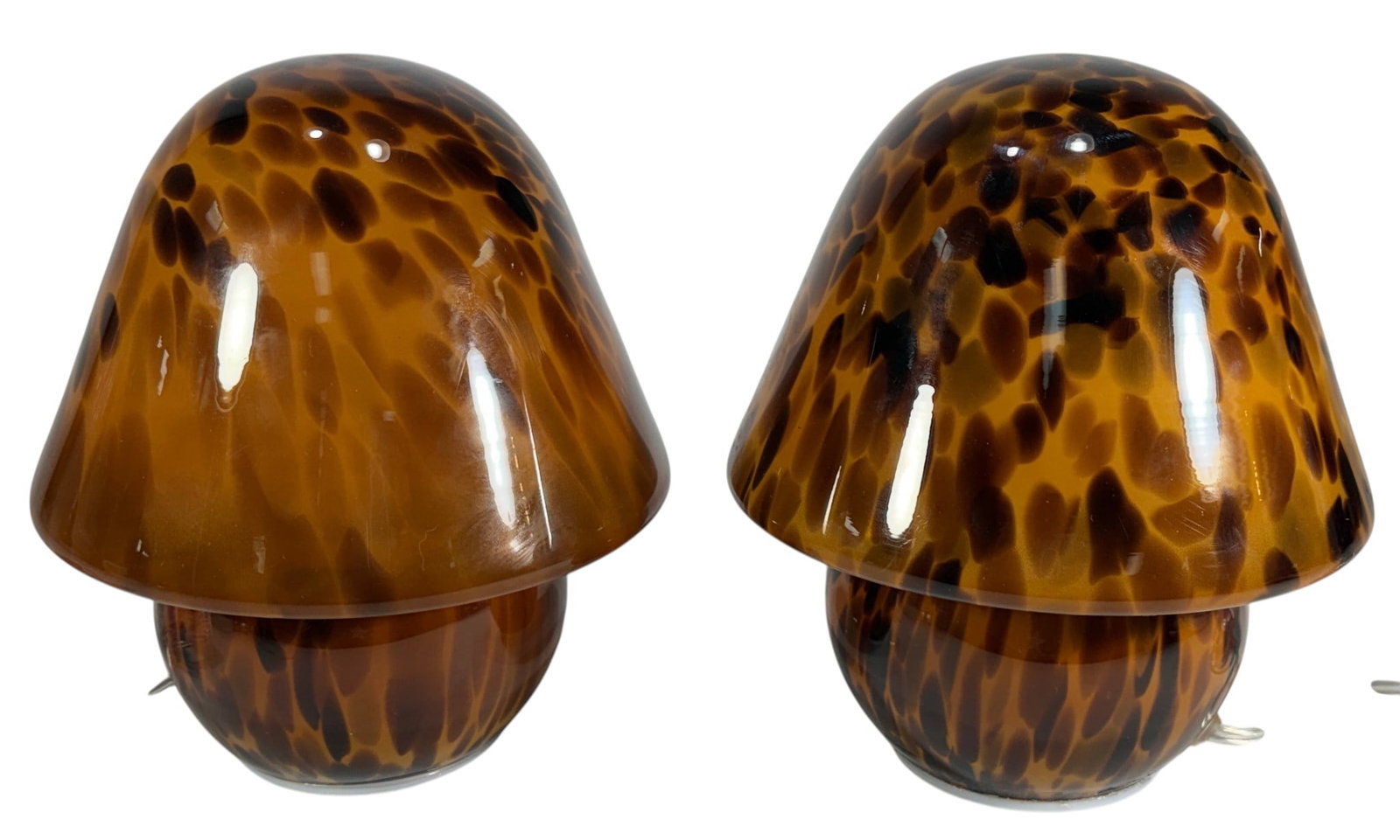 Pair of Murano Style Art Glass Mushroom Lamps: Pair of vintage style Murano style art glass mushroom lamps featuring amber-brown shades with an organic spotted pattern reminiscent of tortoiseshell glass. Each lamp has a rounded mushroom-form shade
