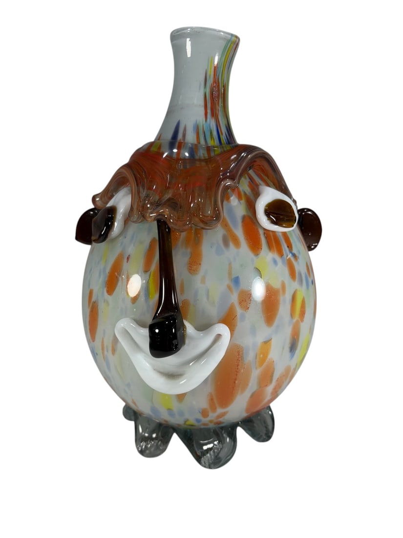 Murano Style Art Glass Clown Face Head Vase 11.5": Murano style hand-blown art glass vase featuring a whimsical clown face with applied eyes, nose, and smile, ruffled collar, multicolor confetti decoration, and clear applied foot. No visible maker's m