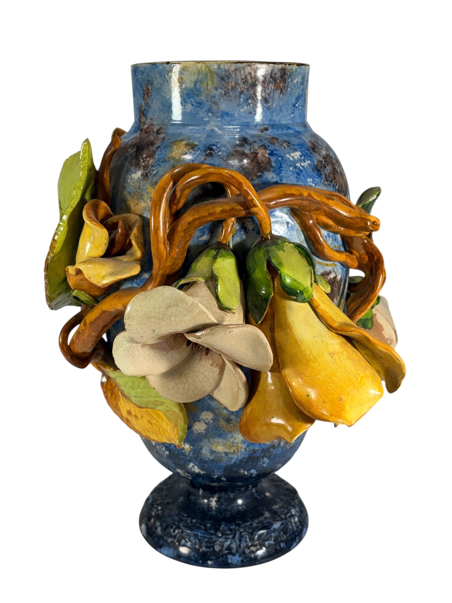 Large Vintage Blue Majolica Barbotine Floral Vase: Vintage majolica barbotine pottery vase featuring a mottled blue glazed body with applied yellow and cream bell-shaped flowers, green leaves, and intertwined vine decoration in high relief. Marked "41