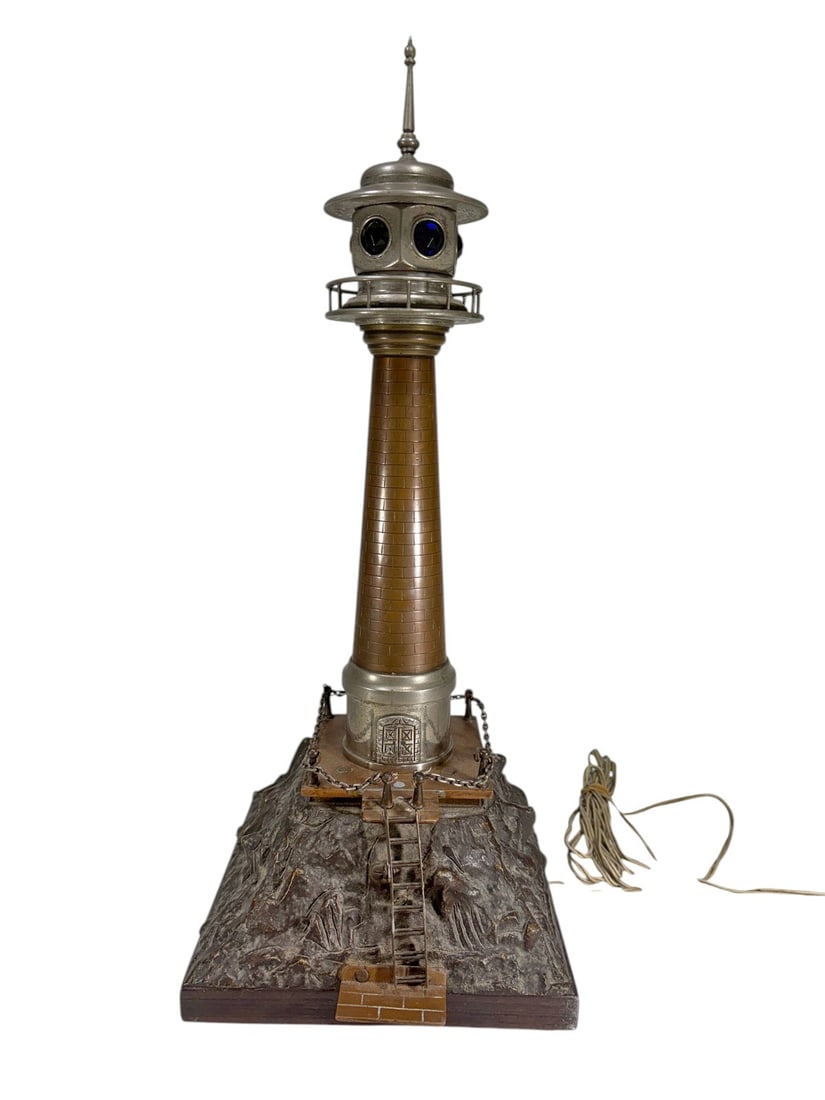 Vintage Lighthouse Table Lamp Nautical Decor Light: Vintage lighthouse-form table lamp featuring a polychrome lens lantern with blue, green, and amber glass inserts, simulated brick tower, and sculptural base decorated with maritime relief scenes. Cons
