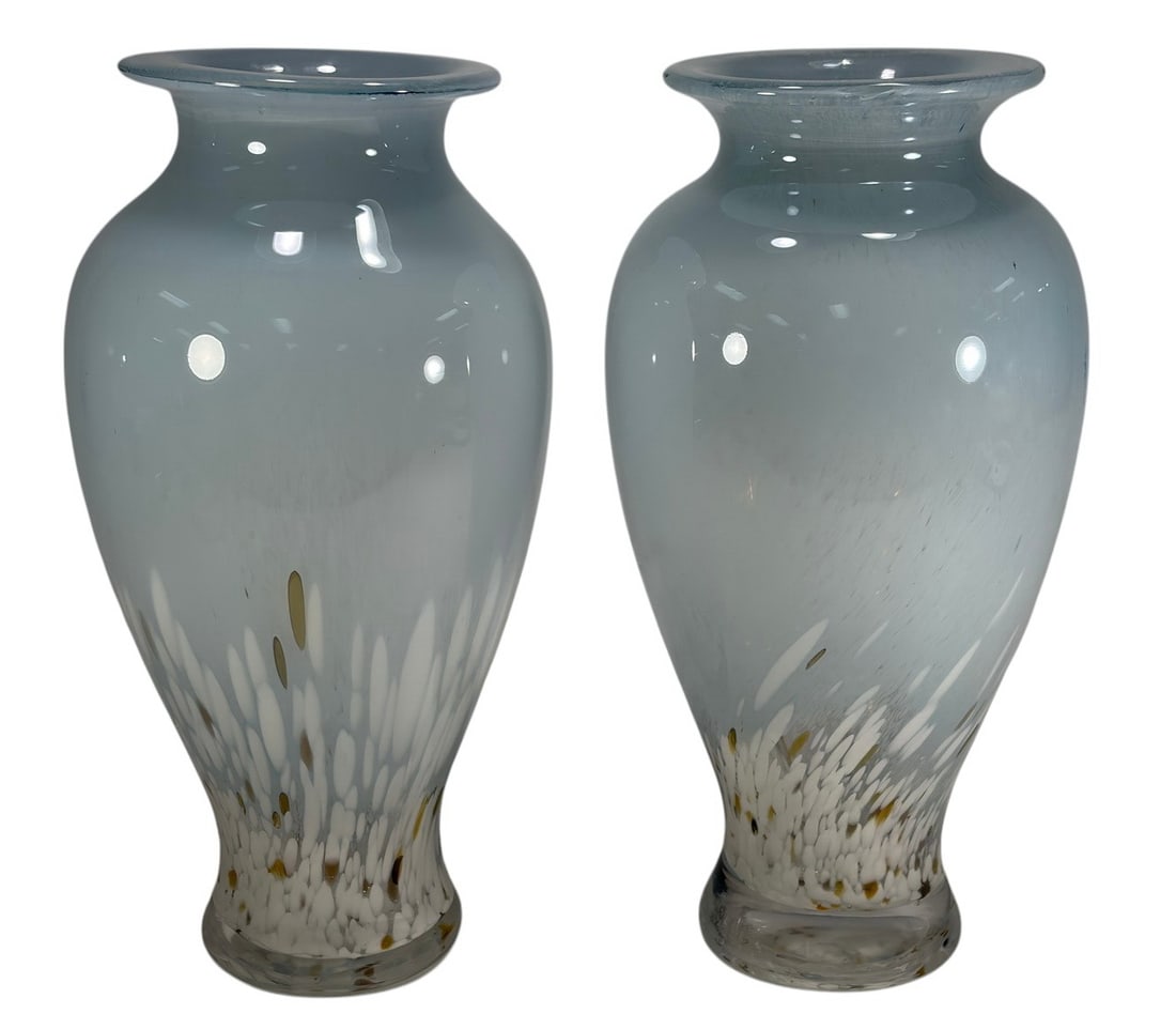 Pair Murano Style Hand Blown White Art Glass Vases: Pair of Murano style hand-blown art glass vases featuring white cased glass with delicate filigrana-style decoration and applied gold foil inclusions concentrated near the base. Each has a flared rim 