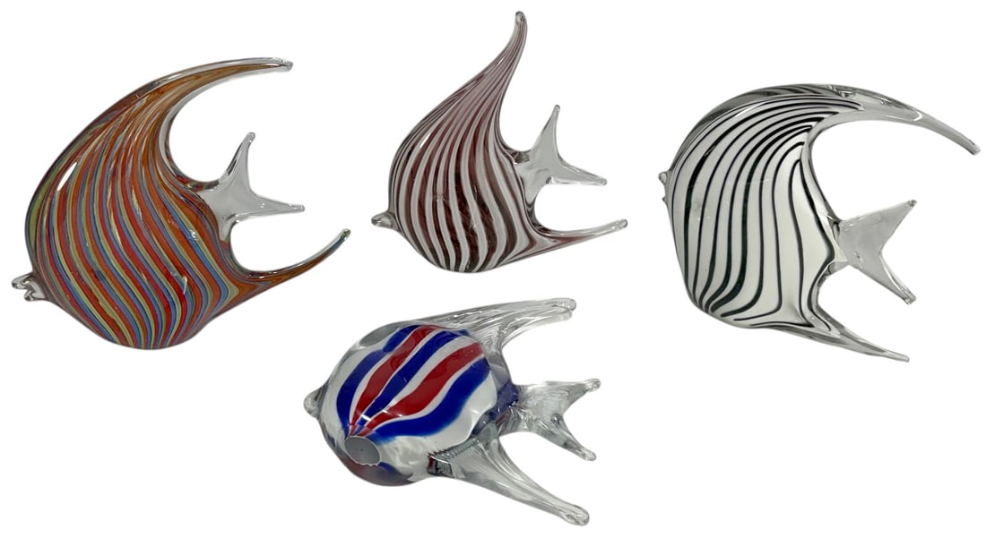 Italian Murano Style Art Glass Fish Figures 4pcs: Group of four Murano style art glass fish figurines in assorted colors and designs including striped, cobalt blue, turquoise, and purple examples. Decorative marine life forms with clear fins, control