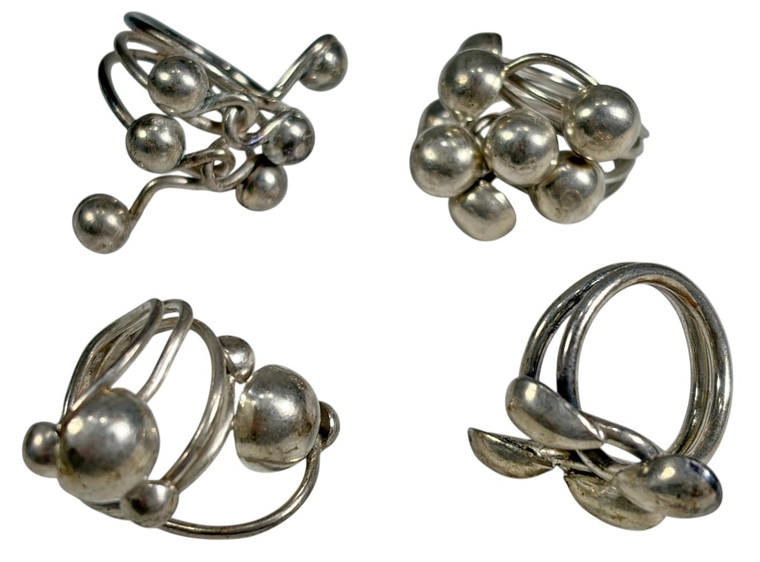 Modern Sculptural Sterling Silver Mixed Rings 4pcs: Lot of 4 modern rings tested as sterling silver by XRF analysis. The rings feature sculptural contemporary designs, including one with a clustered bead motif, one with polished teardrop elements, and 