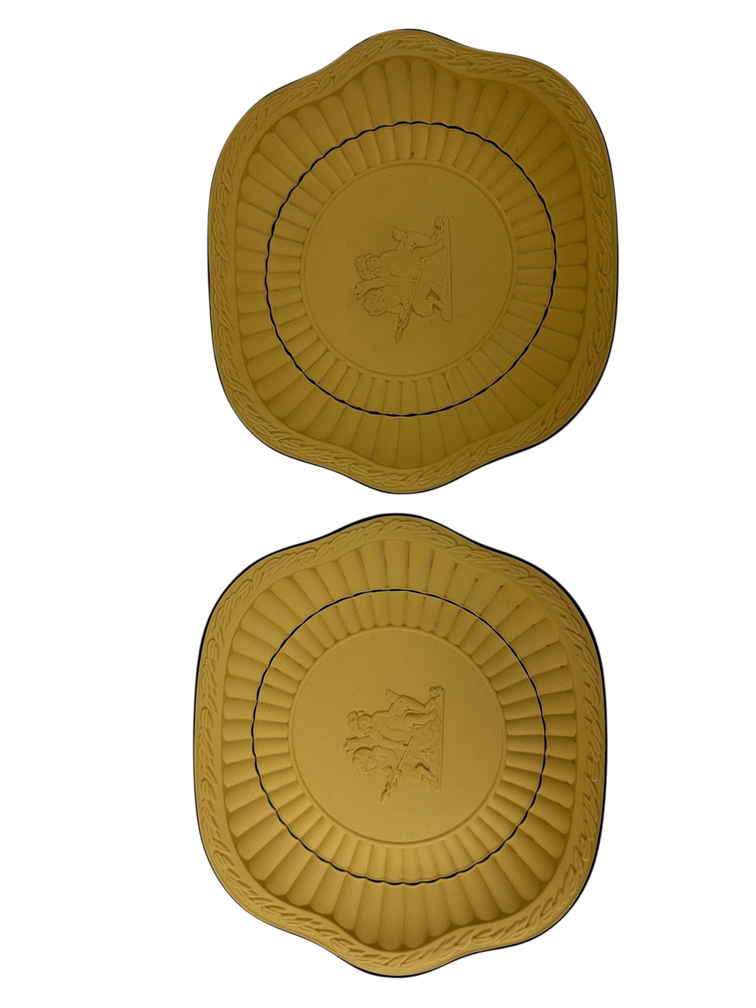 Wedgwood Cane Yellow Jasperware Cupid Plates LOT: Pair of Wedgwood England Cane Yellow Jasperware cream serving trays of rectangular form with rounded corners. Each features a molded fluted basin accented by a black line, a relief laurel border along