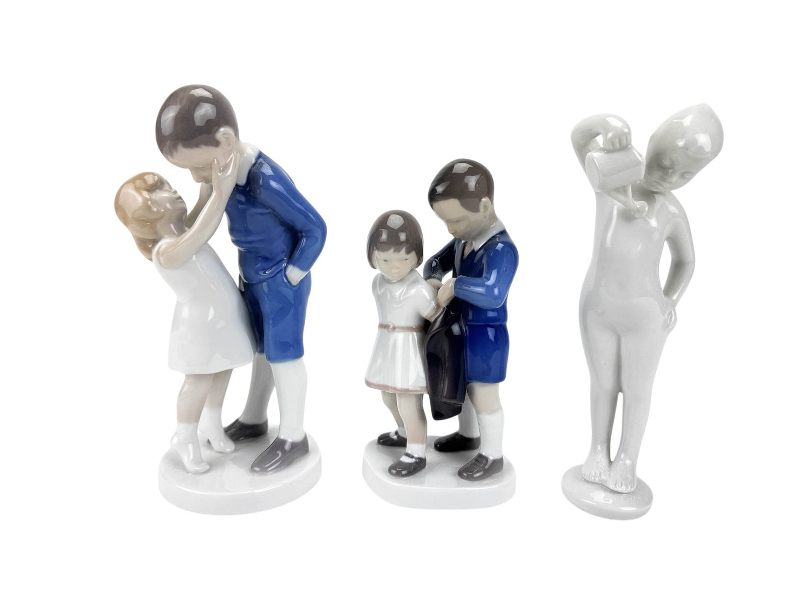 Bing Grondahl & Royal Dux Porcelain Figurines LOT: Measurements range from approximately 7.25" x 2.5" x 3.5" to approximately 8.5" x 3.5" x 3.5". Condition: Good overall condition with normal surface wear. Note: This condition statement is provided as