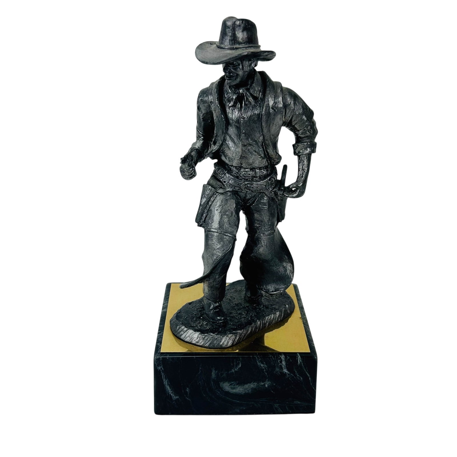 Michael Ricker 1940-2006 Pewter Cowboy Sculpture: Michael Ricker (American, 19402006) hand crafted pewter sculpture with a strong Western theme subject matter. Depicts a cowboy advancing with a revolver drawn and holstered sidearm at his hip. Mounted