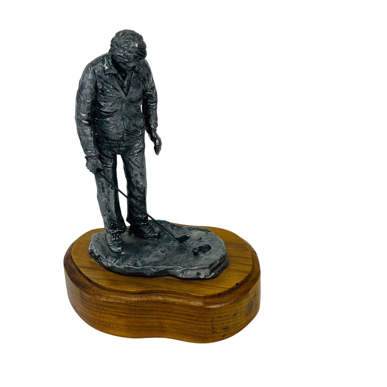 Michael Ricker 1940-2006 Pewter Golfer Sculpture: Michael Ricker (American, 1940-2006) hand crafted pewter sculpture. Depicts a golfer, standing on a textured course base, preparing a putting stroke on a green with golf ball and cup. Mounted to a sha