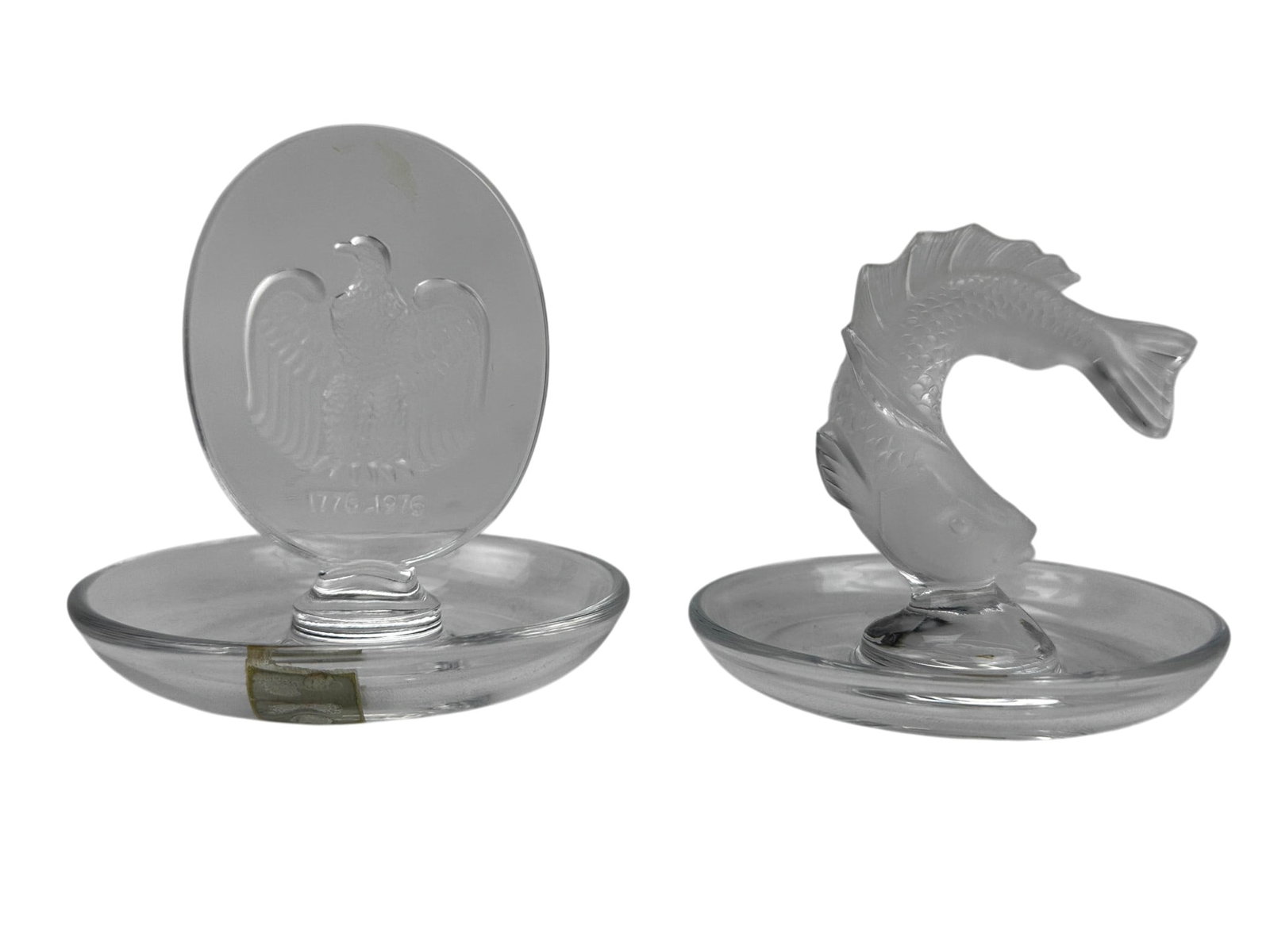 Lalique Bicentennial Eagle & Koi Fish Pin Tray LOT: Lot of two Lalique French crystal decorative desk accessories. Includes the Bicentennial American Eagle with outstretched wings having an intaglio etched frosted design and commemorative inscription 1