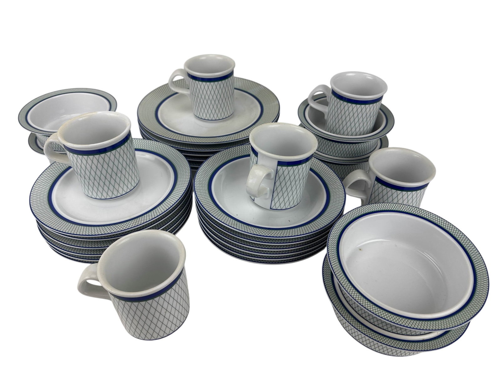 Dansk Porcelain Marquesa Partial Dinnerware Set: Dansk porcelain Marquesa partial dinnerware service. Produced between 2001-2005. The group includes six tea coffee mugs, six cereal / soup / pasta bowls, twelve salad plates and six dinner plates, com