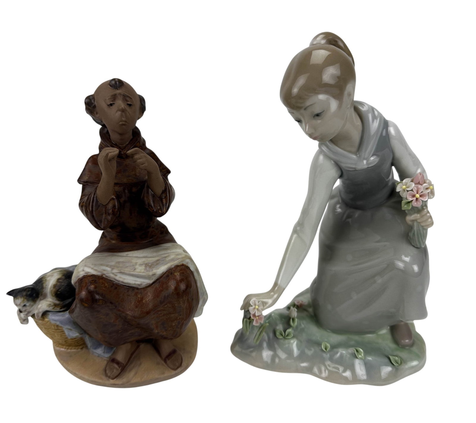 Lladro Girl w/ Flowers & Prayerful Stitch Figurine: Lot of two Lladro Spain hand painted curio cabinet displays. Includes Prayerful Stitch #2205. Designed by sculptor Juan Huerta (1990-1994). Gres finish. Girl with Flowers #1172. Sculpted by Vincente M