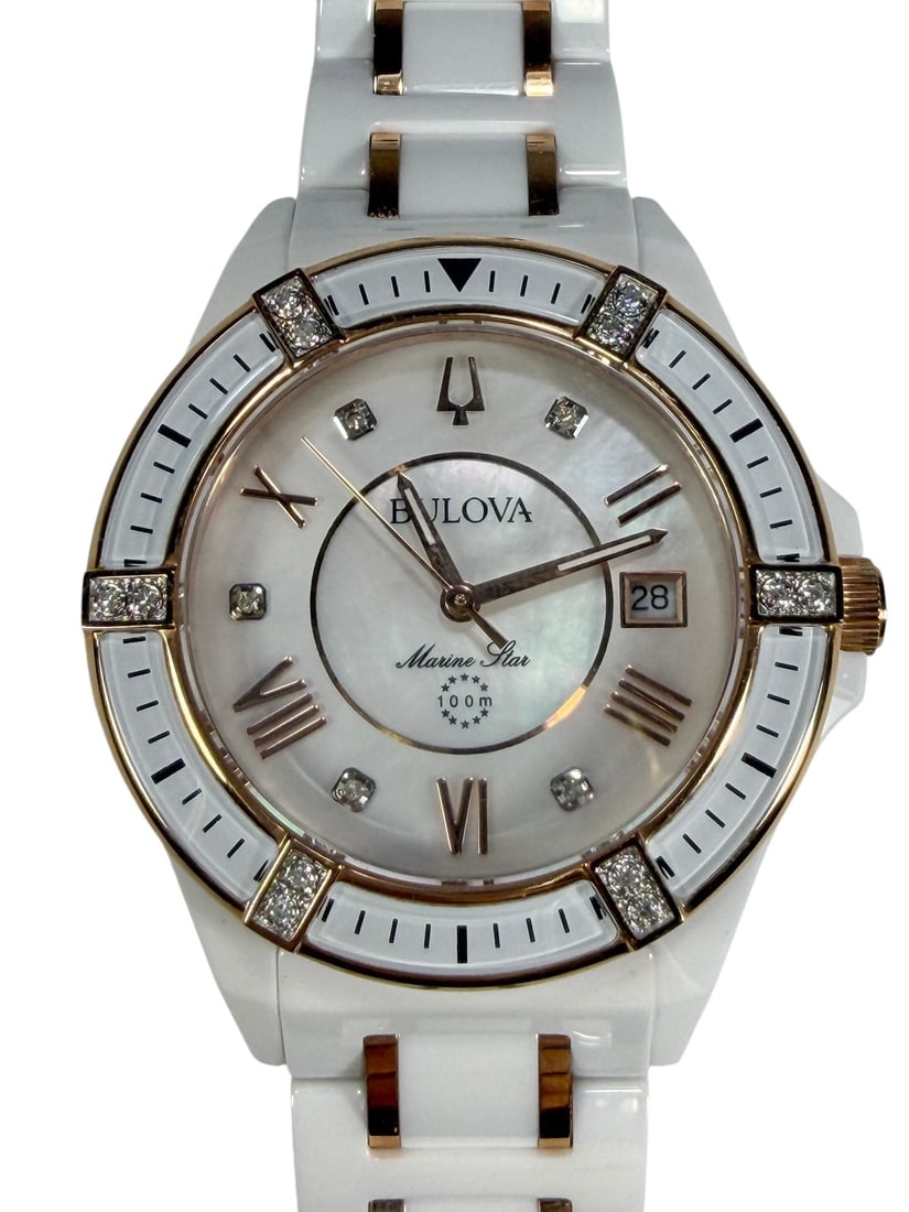 Bulova Marine Star Ceramic Wristwatch White & Gold: Bulova Marine Star quartz wristwatch featuring a white ceramic case and bracelet with rose gold tone accents, mother-of-pearl style dial, date display, crystal hour markers and bezel accents, sapphire