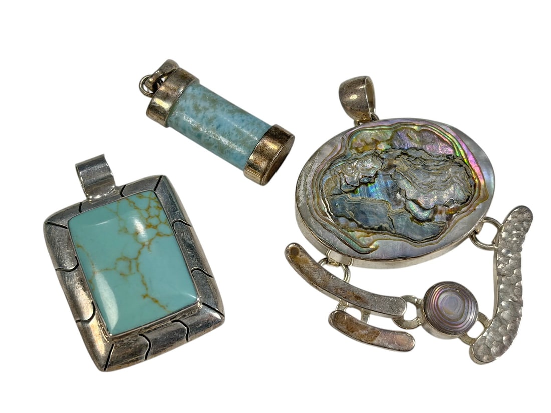 925 Sterling Silver Pendants Turquoise Abalone 3pc: Three-piece sterling silver pendant lot. Includes one rectangular pendant set with a rectangular turquoise cabochon, marked Mexico 925, weighing approximately 15 grams. Also includes one cylindrical t