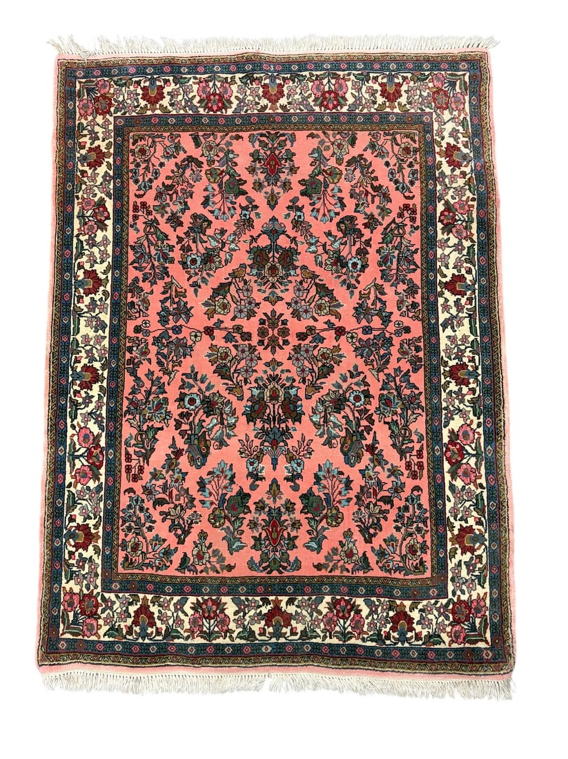 Vintage Persian Style Wool Area Rug Floral Design: Vintage Persian style wool area rug featuring an allover floral pattern with a pink field, ivory border, and multicolor botanical motifs. The design is reminiscent of traditional Persian rugs;