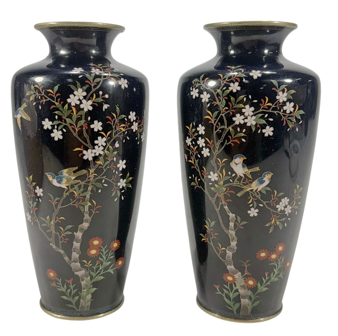 Japanese Cloisonne Floral Bird Vases Meiji Era 2pc: Pair of Japanese cloisonne enamel vases, attributed to the Meiji period, decorated with flowering branches and colorful birds on a dark blue ground. Each vase measures approximately 6 x 2.75 x 2.75