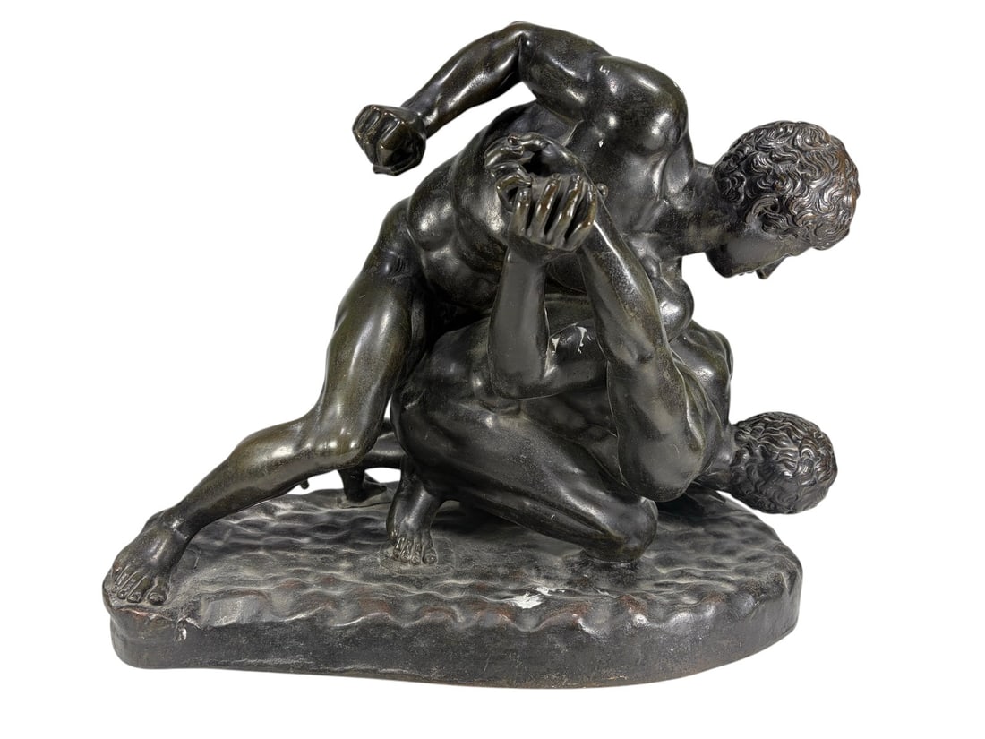 19th C Solid Bronze Wrestling Figural Group Statue: 19th century solid bronze figural group depicting two nude wrestlers engaged in a classical Greco-Roman wrestling match atop a naturalistic base. Well cast with finely modeled anatomy and a rich dark 