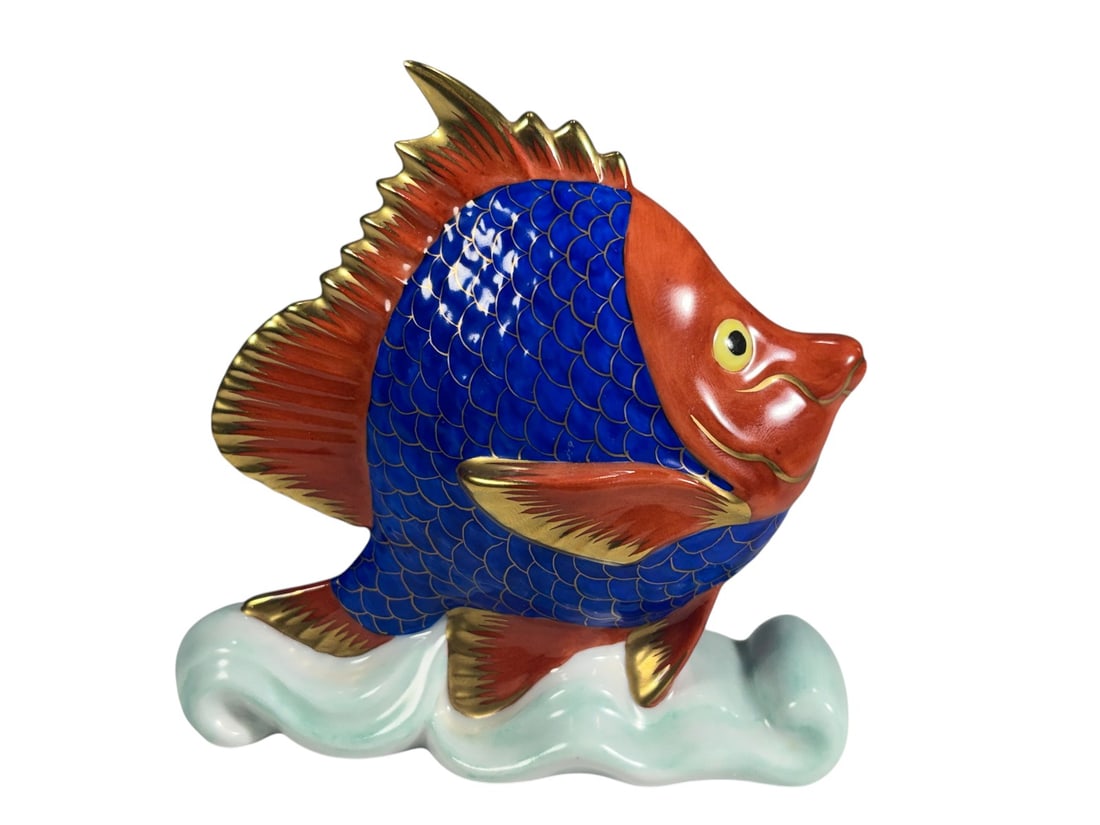 Herend Hungary Hand Painted Fish Figurine Porcelai: Hand-painted Herend Hungary porcelain tropical fish figurine in vibrant cobalt blue, orange, and gilt accents, mounted on a stylized pale aqua wave base. Underside bears the blue Herend Hungary Handpa