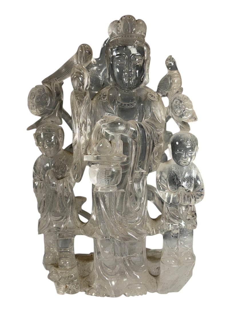 Carved Rock Crystal Guanyin Figure w/ Attendants: Finely carved rock crystal figure depicting Guanyin standing with two attendants, holding a vase and accompanied by birds and lotus blossoms. Executed from a single piece of rock crystal with intricat