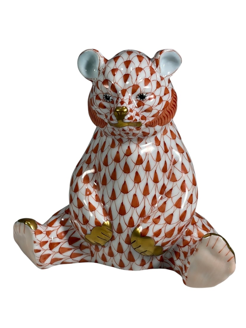 Herend Hungary Fishnet Bear Porcelain Figure: Herend Hungary hand-painted porcelain seated bear figure decorated in the iconic orange fishnet pattern with gilt nose and paw accents. Marked with the Herend Hungary Handpainted backstamp to the unde