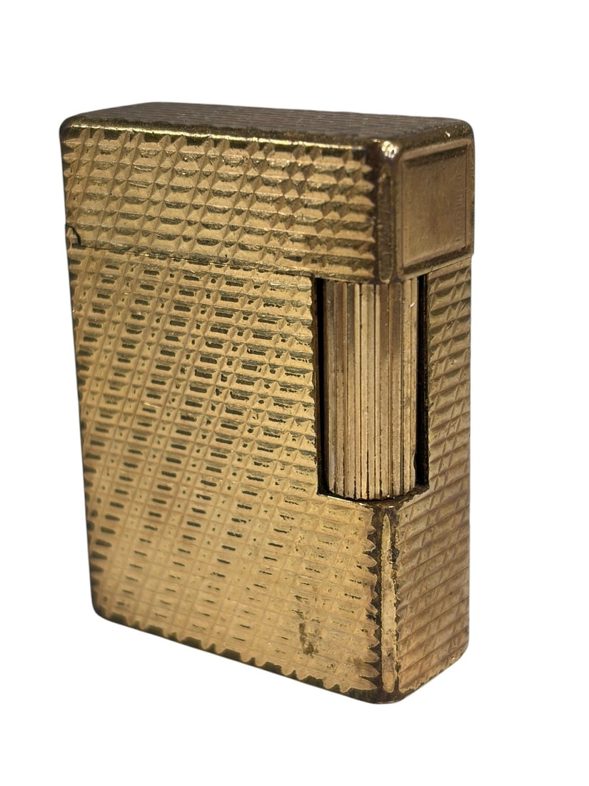 VTG S.T. Dupont Ligne 1 Small Gold Plated Lighter: French S.T. Dupont Ligne 1 Small pocket lighter featuring a gold-plated finish with an engraved diagonal line guilloche pattern. Rectangular form with the maker's signature side roller ignition and pr