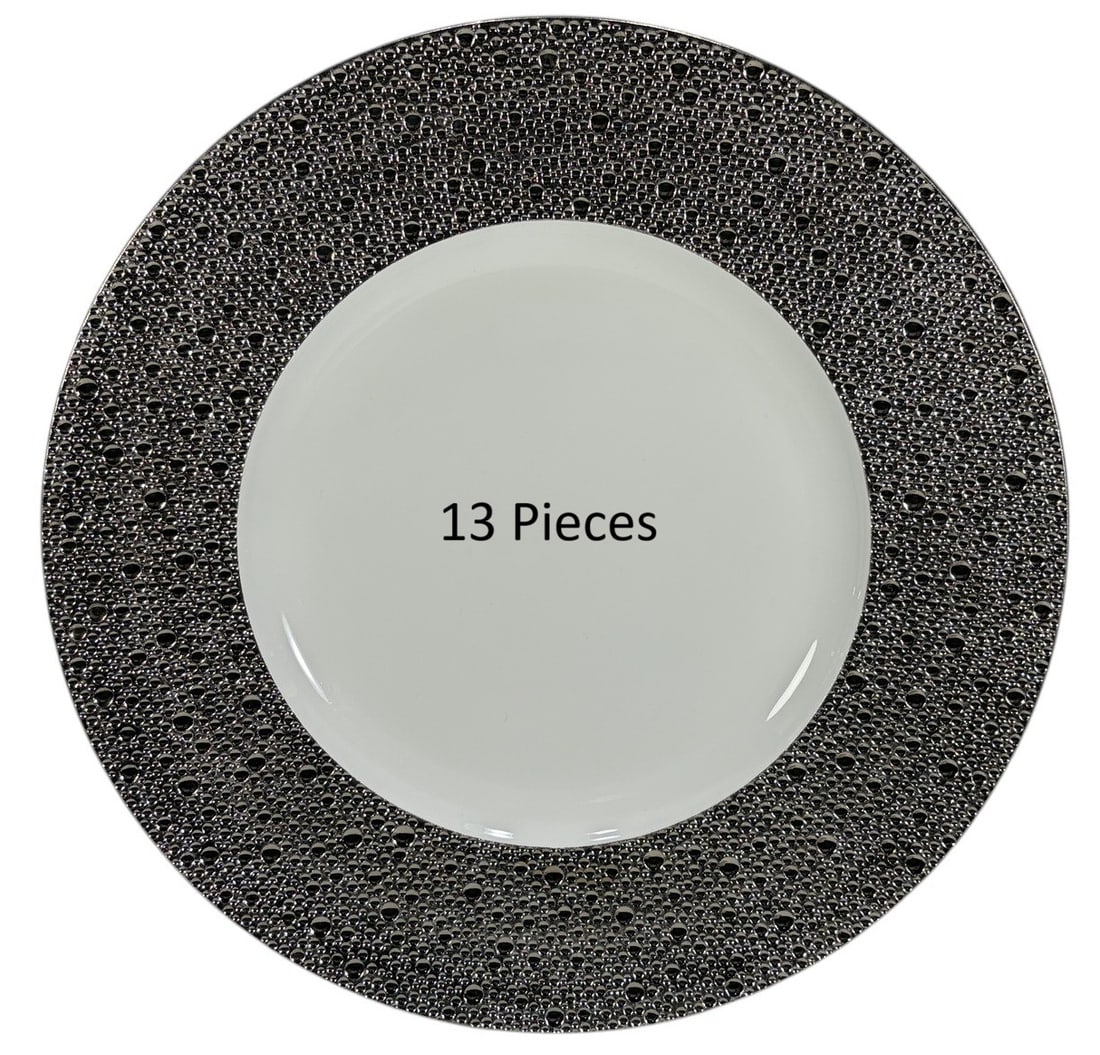 Bernardaud Ecume Platine 12.5" Plates 13pc LOT: Lot of thirteen Bernardaud Limoges "Ecume Platine" porcelain plates, France. Each plate features a wide platinum border with a raised textured pattern inspired by sea foam surrounding a white center. 