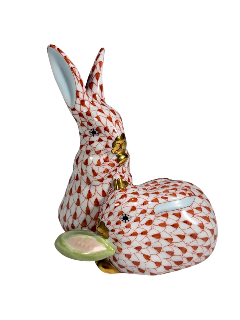 Herend Hungary Rabbit Pair with Corn Porcelain Fig: Herend Hungary hand-painted porcelain figure depicting a pair of rabbits with an ear of corn, decorated in the iconic rust fishnet pattern with gilt accents. Marked Herend Hungary Handpainted to the u